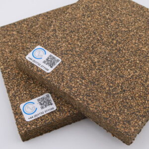 A close-up of two pieces of Neoprene Bonded Cork on a white backdrop