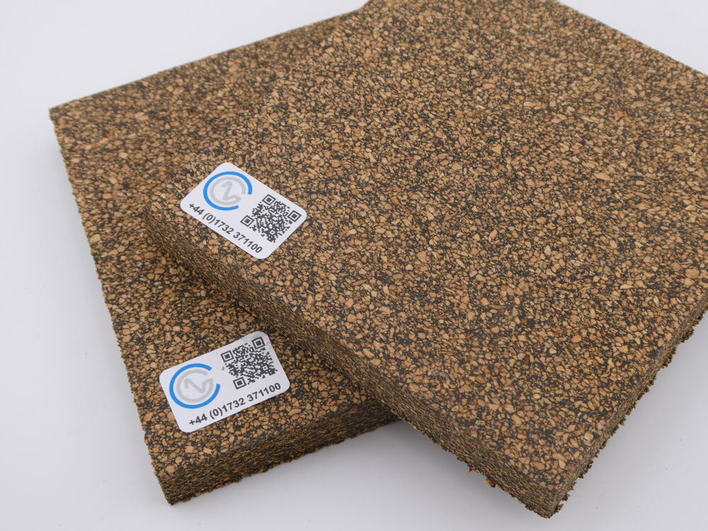 A close-up of two pieces of Neoprene Bonded Cork on a white backdrop